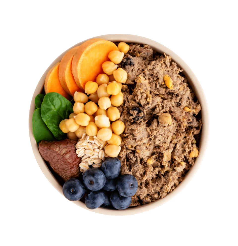 A wooden board with whole DASH ingredients — chicken, sweet potato, blueberries, spinach — the same things you'd reach for in your own kitchen