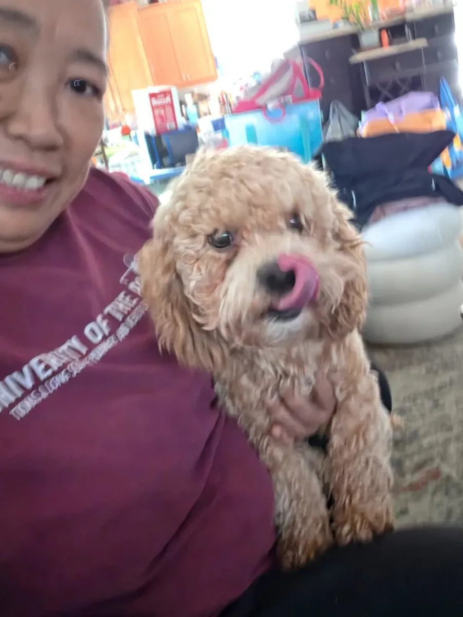 Blossom R. holding one of her dogs